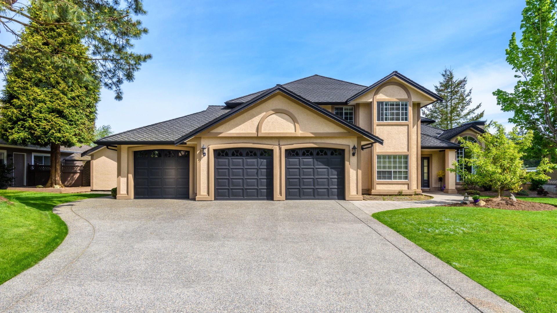 Modern suburban house with a large driveway and double garage